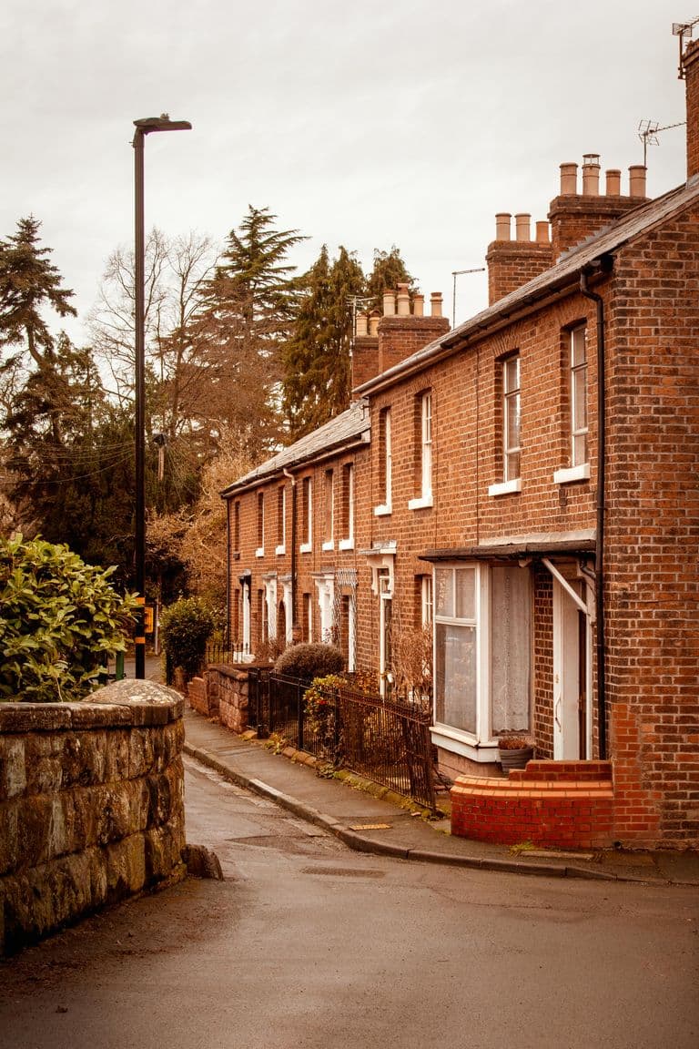 Picturesque row of brick houses on a quiet street in Shrewsbury, England, with a timeless charm